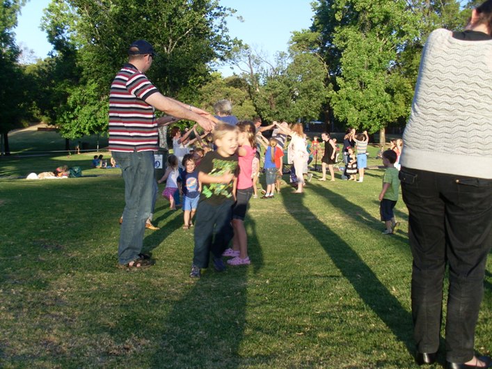 Dancers in circles making arches